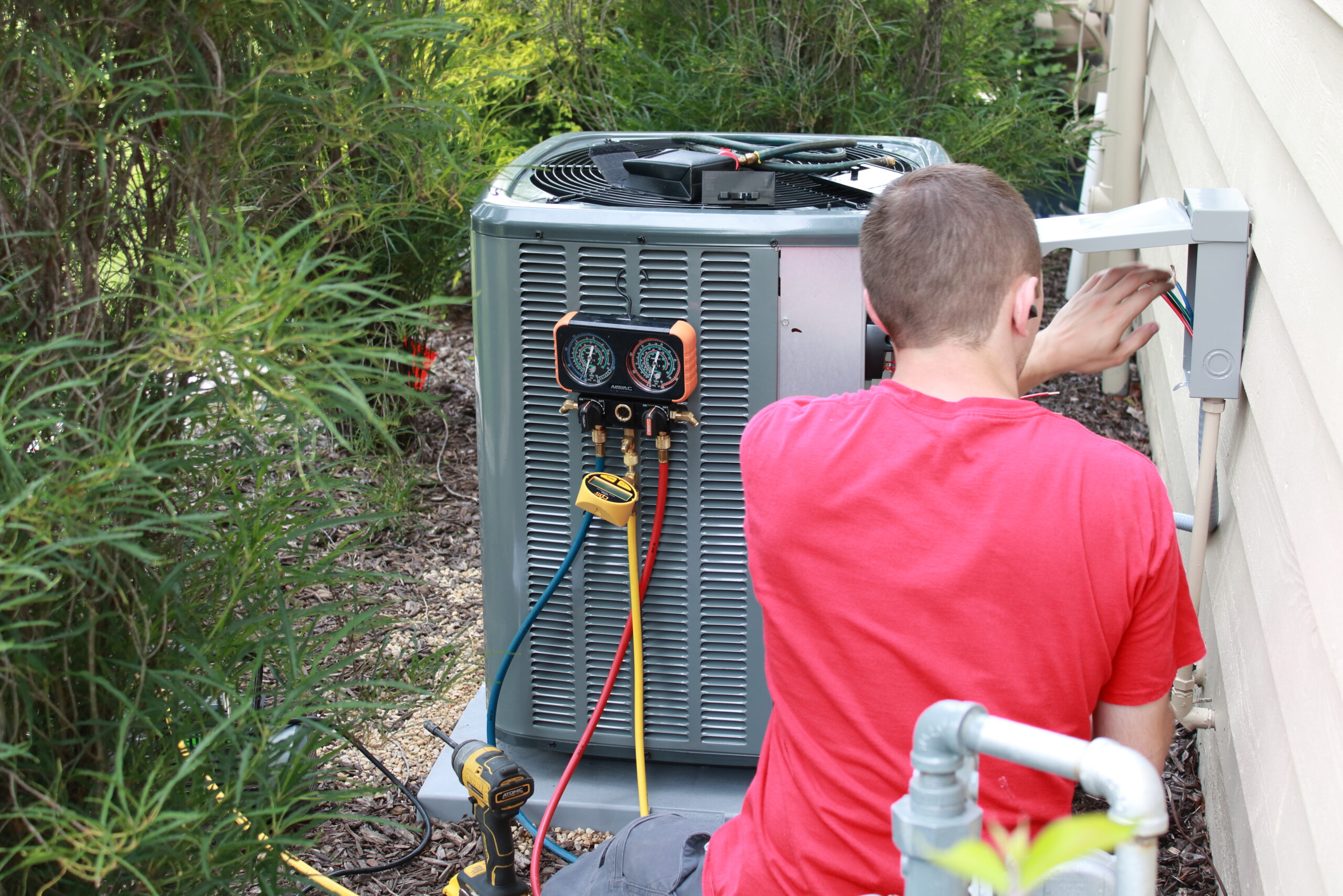 Sub-Cooled technician performing AC maintenance in Northwest Indiana
